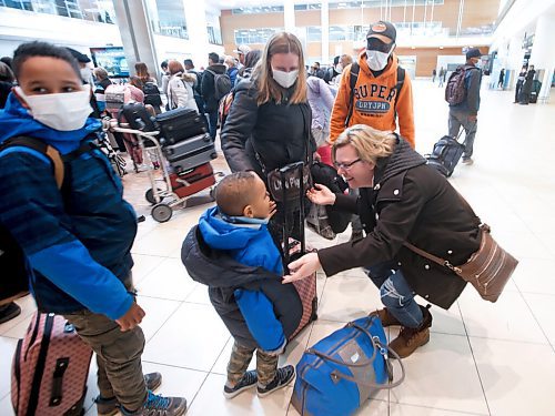 JOHN WOODS / WINNIPEG FREE PRESS
Viktoriia Katsol and Christian Anayo Egwuom with their children Davyd, 9, and Filip, 4, from Ukraine are welcomed to Winnipeg by Aniela Hannaford, owner of Brown's Clearwater West Lodge in Atikokan, Ontario at the Winnipeg airport Friday, April 15, 2022. Hannaford has opened up her lodge to people escaping the Russian invasion of Ukraine.

Re: streilein