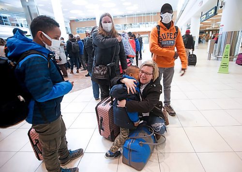 JOHN WOODS / WINNIPEG FREE PRESS
Viktoriia Katsol and Christian Anayo Egwuom with their children Davyd, 9, and Filip, 4, from Ukraine are welcomed to Winnipeg by Aniela Hannaford, owner of Brown's Clearwater West Lodge in Atikokan, Ontario at the Winnipeg airport Friday, April 15, 2022. Hannaford has opened up her lodge to people escaping the Russian invasion of Ukraine.

Re: streilein