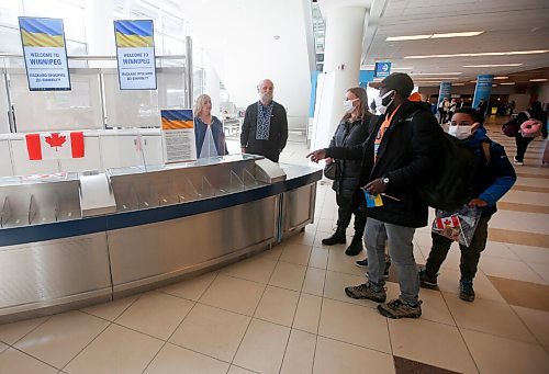 JOHN WOODS / WINNIPEG FREE PRESS
Viktoriia Katsol and Christian Anayo Egwuom with their children Davyd, 9, and Filip, 4, from Ukraine are welcomed to Winnipeg by Taras Maluzynsky, centre, of the Ukrainian Canadian Congress - Manitoba Welcome Desk at the Winnipeg airport Friday, April 15, 2022. Aniela Hannaford, not shown, owner of Brown's Clearwater West Lodge in Atikokan, Ontario has opened up her lodge to people escaping the Russian invasion of Ukraine.

Re: streilein