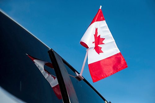 MIKAELA MACKENZIE / WINNIPEG FREE PRESS

Alexander Leontiev's car, decorated with Canadian flags, in Wrzesnia on Tuesday, April 12, 2022. For Melissa story.
Winnipeg Free Press 2022.