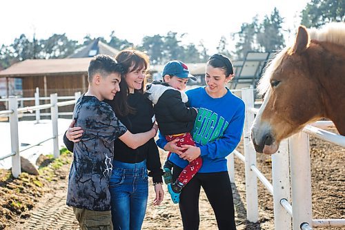 MIKAELA MACKENZIE / WINNIPEG FREE PRESS

Max Shebanov (13, left), Kate Shebanova, Alina Mykholevska, and Timur Mykholevskiy (three) on the farm that they're staying just outside of Wrzesnia on Tuesday, April 12, 2022. For Melissa story.
Winnipeg Free Press 2022.