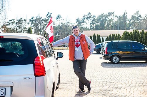 MIKAELA MACKENZIE / WINNIPEG FREE PRESS

Alexander Leontiev poses for a portrait with his car, which he has decorated with Canadian flags, in Wrzesnia on Tuesday, April 12, 2022. For Melissa story.
Winnipeg Free Press 2022.