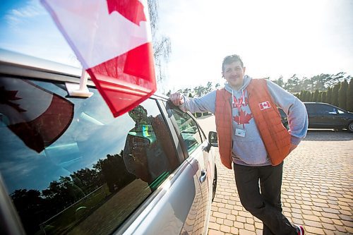 MIKAELA MACKENZIE / WINNIPEG FREE PRESS

Alexander Leontiev poses for a portrait with his car, which he has decorated with Canadian flags, in Wrzesnia on Tuesday, April 12, 2022. For Melissa story.
Winnipeg Free Press 2022.