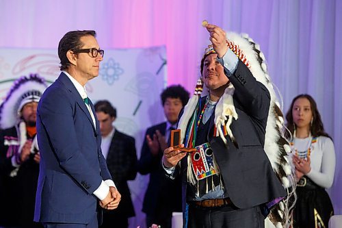 MIKE DEAL / WINNIPEG FREE PRESS
Southern Chiefs Organization Grand Chief, Jerry Daniels accepts a gift of a special coin from the HBC Governor, Richard Baker during the ceremony where the SCO took possession of the downtown Winnipeg, Hudsons Bay Co. building from the HBC.
The Southern Chiefs' Organization took possession of the downtown Winnipeg, Hudsons Bay Co. building during a two-hour ceremony Friday morning, which was attended by Prime Minister Trudeau, Manitoba Premier Heather Stefanson, Southern Chiefs Organization Grand Chief, Jerry Daniels, HBC Governor, Richard Baker, Ahmed Hussen, Minister of Housing and Diversity and Inclusion, Patty Hajdu, Minister of Indigenous Services Canada, and Dan Vandal, Minister of Northern Affairs and Minister responsible for Prairies Economic Development Canada. The vacant six-storey building, which opened in 1926 was closed in November 2020.
220422 - Friday, April 22, 2022.