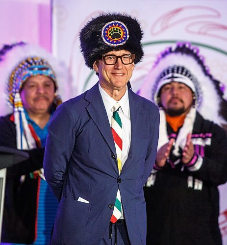 MIKE DEAL / WINNIPEG FREE PRESS
HBC Governor, Richard Baker accepts the gift of a beaver hat during the ceremony.
The Southern Chiefs Organization took posession of the downtown Winnipeg, Hudsons Bay Co. building during a two-hour ceremony Friday morning, which was attended by Prime Minister Trudeau, Manitoba Premier Heather Stefanson, Southern Chiefs Organization Grand Chief, Jerry Daniels, HBC Governor, Richard Baker, Ahmed Hussen, Minister of Housing and Diversity and Inclusion, Patty Hajdu, Minister of Indigenous Services Canada, and Dan Vandal, Minister of Northern Affairs and Minister responsible for Prairies Economic Development Canada. The vacant six-storey building, which opened in 1926 was closed in November 2020.
220422 - Friday, April 22, 2022.