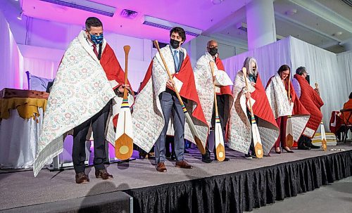 MIKE DEAL / WINNIPEG FREE PRESS
Special guests (from left), Winnipeg Mayor Brian Bowman, Prime Minister Trudeau, Ahmed Hussen, Minister of Housing and Diversity and Inclusion, Patty Hajdu, Minister of Indigenous Services Canada, Manitoba Premier Heather Stefanson, and Dan Vandal, Minister of Northern Affairs and Minister responsible for Prairies Economic Development Canada, receive commissioned blankets from SCO and paddles from HBC.
The Southern Chiefs Organization took possession of the downtown Winnipeg, Hudsons Bay Co. building during a two-hour ceremony Friday morning, which was attended by Prime Minister Trudeau, Manitoba Premier Heather Stefanson, Southern Chiefs Organization Grand Chief, Jerry Daniels, HBC Governor, Richard Baker, Ahmed Hussen, Minister of Housing and Diversity and Inclusion, Patty Hajdu, Minister of Indigenous Services Canada, and Dan Vandal, Minister of Northern Affairs and Minister responsible for Prairies Economic Development Canada. The vacant six-storey building, which opened in 1926 was closed in November 2020.
220422 - Friday, April 22, 2022.