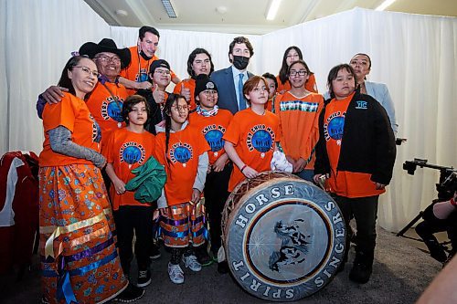 MIKE DEAL / WINNIPEG FREE PRESS
Prime Minister Trudeau gets his photo taken with the Spirit Horse Singers after the ceremony.
The Southern Chiefs Organization took posession of the downtown Winnipeg, Hudsons Bay Co. building during a two-hour ceremony Friday morning, which was attended by Prime Minister Trudeau, Manitoba Premier Heather Stefanson, Southern Chiefs Organization Grand Chief, Jerry Daniels, HBC Governor, Richard Baker, Ahmed Hussen, Minister of Housing and Diversity and Inclusion, Patty Hajdu, Minister of Indigenous Services Canada, and Dan Vandal, Minister of Northern Affairs and Minister responsible for Prairies Economic Development Canada. The vacant six-storey building, which opened in 1926 was closed in November 2020.
220422 - Friday, April 22, 2022.