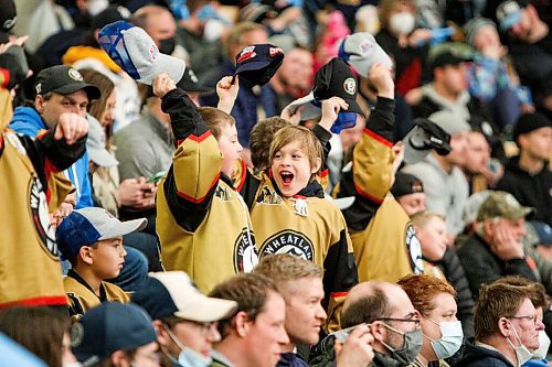 Daniel Crump / Winnipeg Free Press. Young Winnipeg Ice fans cheer as the Winnipeg Ice take on the visiting Prince Albert Raiders in game one, round one, of the WHL playoffs, at Wayne Fleming Arena in Winnipeg. April 22, 2022.