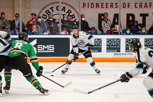 Daniel Crump / Winnipeg Free Press. Winnipeg Ice defenseman Nolan Orzeck (8) looks for a play as the Winnipeg Ice take on the visiting Prince Albert Raiders in game one, round one, of the WHL playoffs, at Wayne Fleming Arena in Winnipeg. April 22, 2022.