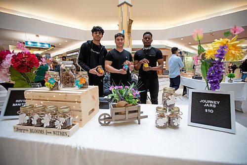 Daniel Crump / Winnipeg Free Press. Navneet Manan, Stefan Cvijic, and Olusola Adeboooye are students taking part in a trade fair at Kildonan Place this weekend to show off their new student-built product, the Journey Jar. The jar was created by the Windsor Park students as part of Achievement Manitoba, an after-school program, that involves teacher mentors who help groups of students build their own businesses. April 23, 2022.