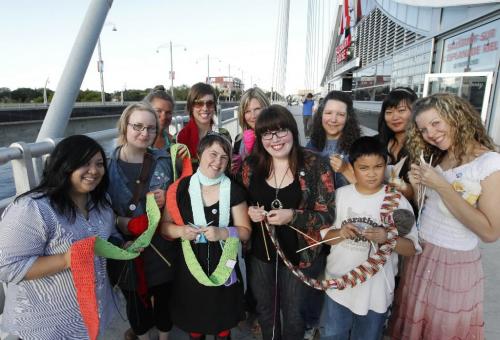 BORIS.MINKEVICH@FREEPRESS.MB.CA  100818 BORIS MINKEVICH / WINNIPEG FREE PRESS Knitting the Bridge. Esplanade Riel Bridge. Kristin Nelson (short one) and Jennifer Smith pose for a photo. They are meeting a big group of knitters at Sals knit.