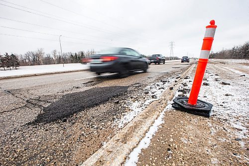 MIKAELA MACKENZIE / WINNIPEG FREE PRESS

Freshly tarred-over potholes on Bishop Grandin Boulevard in Winnipeg on Monday, April 25, 2022. For --- story.
Winnipeg Free Press 2022.