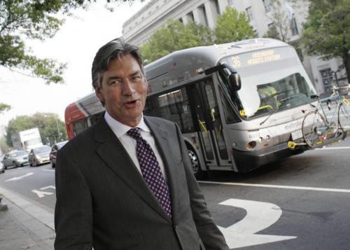 Canada's Ambassador to the United States, Gary Doer, admires a New Flyer bus near his office at the Canadian Embassy in Washington DC, August 11, 2010. Lyle Stafford for the Winnipeg Free Press