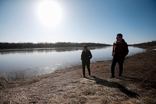 JOHN WOODS / WINNIPEG FREE PRESS
Nicole Sorin and her son Rheal are photographed beside the Red River at their home just north of Aubigny Tuesday, April 26, 2022. Sorin gave birth to Rheal just before the 1997 flood and were evacuated from the family home.

Re: