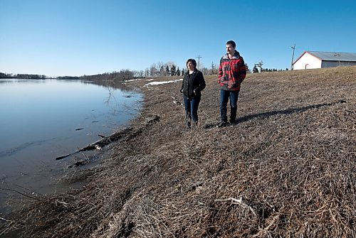 JOHN WOODS / WINNIPEG FREE PRESS
Nicole Sorin and her son Rheal are photographed beside the Red River at their home just north of Aubigny Tuesday, April 26, 2022. Sorin gave birth to Rheal just before the 1997 flood and were evacuated from the family home.

Re: