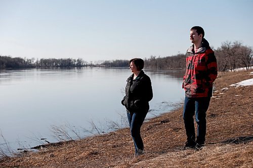 JOHN WOODS / WINNIPEG FREE PRESS
Nicole Sorin and her son Rheal are photographed beside the Red River at their home just north of Aubigny Tuesday, April 26, 2022. Sorin gave birth to Rheal just before the 1997 flood and were evacuated from the family home.

Re: