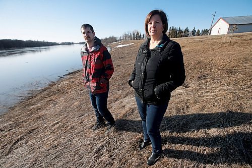 JOHN WOODS / WINNIPEG FREE PRESS
Nicole Sorin and her son Rheal are photographed beside the Red River at their home just north of Aubigny Tuesday, April 26, 2022. Sorin gave birth to Rheal just before the 1997 flood and were evacuated from the family home.

Re: