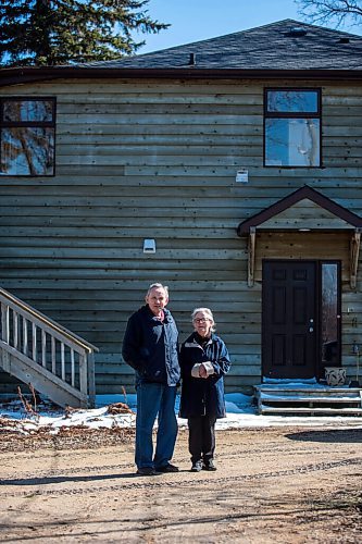 MIKAELA MACKENZIE / WINNIPEG FREE PRESS

Bob and Judy Roehle, St. Norbert homeowners who shared their memories of the 1997 flood, pose for a portrait by the house that nearly floated away (which has since been rebuilt 10 feet higher) on their property on Tuesday, April 26, 2022.
Winnipeg Free Press 2022.