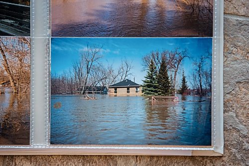 MIKAELA MACKENZIE / WINNIPEG FREE PRESS

A photo album with Bob and Judy Roehle's memories of the 1997 flood (here, the house on their property that nearly floated away) in St. Norbert on Tuesday, April 26, 2022.
Winnipeg Free Press 2022.