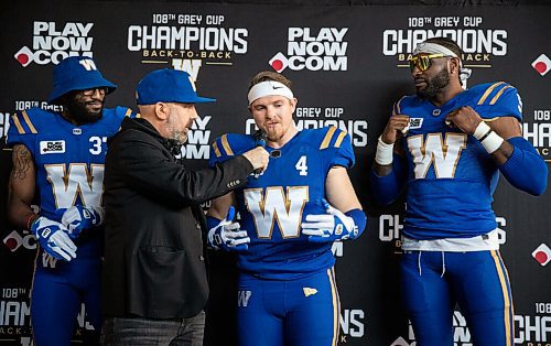 JESSICA LEE / WINNIPEG FREE PRESS

Blue Bombers players (from left) safety Brandon Alexander, linebacker Adam Bighill and defensive end Willie Jefferson are interviewed by Mark Morris while modelling new uniforms on April 28, 2022 at the Pinnacle Club at IG Field.
