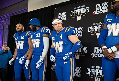 JESSICA LEE / WINNIPEG FREE PRESS

Blue Bombers players (from left) receiver Nic Demski, safety Brandon Alexander, linebacker Adam Bighill and defensive end Willie Jefferson show off new uniforms on April 28, 2022 at the Pinnacle Club at IG Field.

