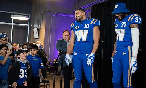 JESSICA LEE / WINNIPEG FREE PRESS

Blue Bombers players (from left) receiver Nic Demski, and safety Brandon Alexander model new uniforms on April 28, 2022 at the Pinnacle Club at IG Field.
