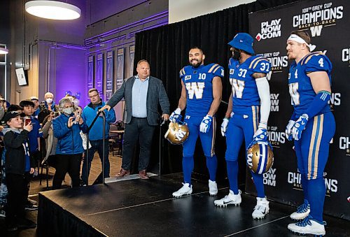 JESSICA LEE / WINNIPEG FREE PRESS

Blue Bombers players (third from left, to right) receiver Nic Demski, safety Brandon Alexander and linebacker Adam Bighill show off new uniforms on April 28, 2022 at the Pinnacle Club at IG Field.
