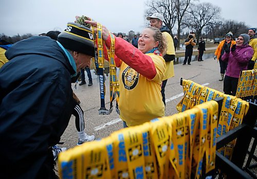 JOHN WOODS / WINNIPEG FREE PRESS
Marianna Dziver, oncology nurse and volunteer at the Winnipeg Police Service (WPS) Half Marathon puts a medal on runner Jack Dubnicoff, 85, in Assiniboine Park Sunday, May 1, 2022. Proceeds go to the Canadian Cancer Society. When asked why he ran he replied, "I love to run, and I've got to keep going until I get around the corner"

Re: Searle