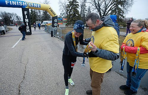 JOHN WOODS / WINNIPEG FREE PRESS
A runner gets a medal and assistance at the Winnipeg Police Service (WPS) Half Marathon in Assiniboine Park Sunday, May 1, 2022. Proceeds go to the Canadian Cancer Society.

Re: Searle