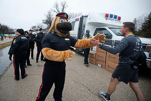 JOHN WOODS / WINNIPEG FREE PRESS
Copper, WPS mascot, high fives runners as they cross the finish at the Winnipeg Police Service (WPS) Half Marathon in Assiniboine Park Sunday, May 1, 2022. Proceeds go to the Canadian Cancer Society.

Re: Searle