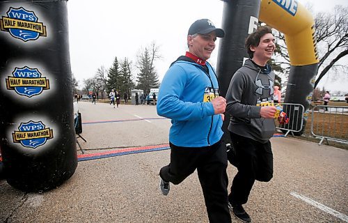 JOHN WOODS / WINNIPEG FREE PRESS
Kevin and Tyler Kavitch, ran for their wife and mum Linda, at the Winnipeg Police Service (WPS) Half Marathon in Assiniboine Park Sunday, May 1, 2022. Proceeds go to the Canadian Cancer Society. Linda died of cancer recently.

Re: Searle