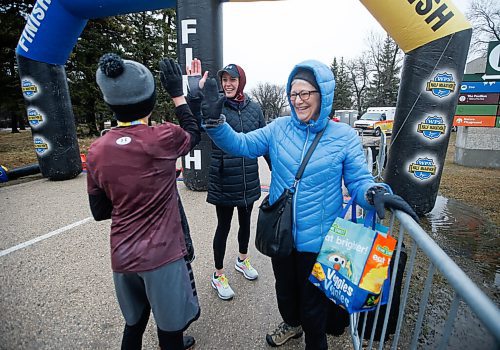 JOHN WOODS / WINNIPEG FREE PRESS
Carter Holfeld, 12, high fives his mother Kristy Holfeld and grandmother Marilyn Leclair  as he finishes  the Winnipeg Police Service (WPS) Half Marathon in Assiniboine Park Sunday, May 1, 2022. Proceeds go to the Canadian Cancer Society.

Re: Searle