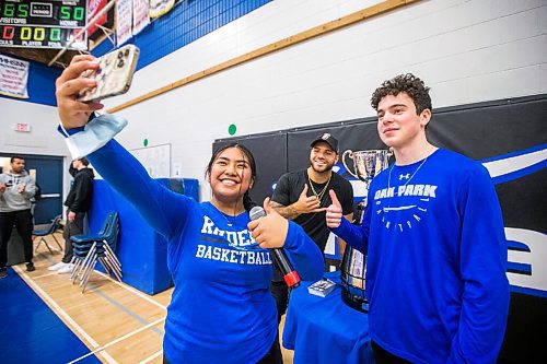 MIKAELA MACKENZIE / WINNIPEG FREE PRESS

Grade 12 students Kyla Marquez (left) and Ian Surasky pose for a selfie with Brady Olivera and the Grey Cup at Oak Park School in Winnipeg on Monday, May 2, 2022. For Taylor Allen story.
Winnipeg Free Press 2022.