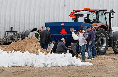 JOHN WOODS / WINNIPEG FREE PRESS
Sandbags are made in preparation for flooding at the RM of Cartier facility in Elie, MB Monday, May 2, 2022. The combination of a high La Salle River and field runoff has resulted in high water levels throughout town.

Re: ?