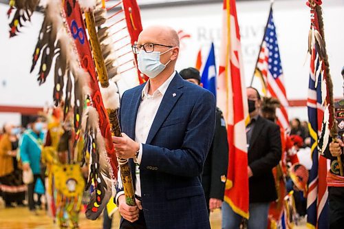 MIKAELA MACKENZIE / WINNIPEG FREE PRESS

RRC Polytech president Fred Meier leads the flag ceremony during a graduation Pow Wow in Winnipeg on Friday, May 6, 2022. For Malak Abas story.
Winnipeg Free Press 2022.