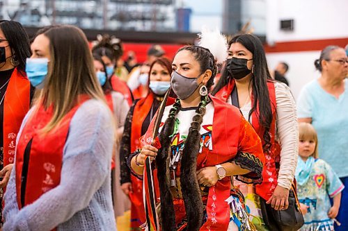 MIKAELA MACKENZIE / WINNIPEG FREE PRESS

RRC Polytech graduate Cheryl Baraniuk dances out during the grand entry at the RRC graduation Pow Wow in Winnipeg on Friday, May 6, 2022. For Malak Abas story.
Winnipeg Free Press 2022.