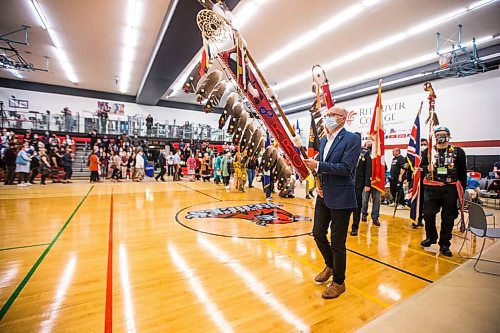 MIKAELA MACKENZIE / WINNIPEG FREE PRESS

RRC Polytech president Fred Meier leads the flag ceremony during a graduation Pow Wow in Winnipeg on Friday, May 6, 2022. For Malak Abas story.
Winnipeg Free Press 2022.