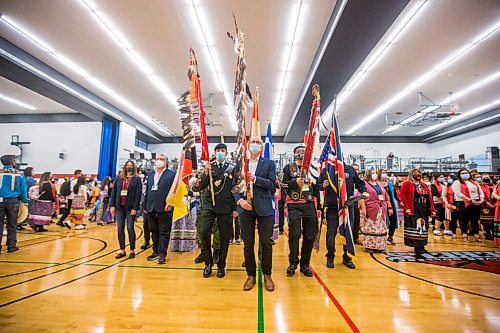 MIKAELA MACKENZIE / WINNIPEG FREE PRESS

RRC Polytech president Fred Meier leads the flag ceremony during a graduation Pow Wow in Winnipeg on Friday, May 6, 2022. For Malak Abas story.
Winnipeg Free Press 2022.