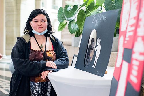 MIKAELA MACKENZIE / WINNIPEG FREE PRESS

Argyle Alternative High School grade 12 student Ricki-Lynn Crain poses for a portrait by her art, which is displayed at the Manitoba Legislative Building in honour of Child and Youth Mental Health Day, in Winnipeg on Friday, May 6, 2022. For Katie May story.
Winnipeg Free Press 2022.