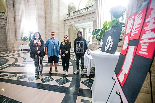 MIKAELA MACKENZIE / WINNIPEG FREE PRESS

Argyle Alternative High School students Ricki-Lynn Crain (left), Ethan McInnes, Maia Kasian, and Tyler Boyle pose for a portrait by their art displayed at an announcement of Child and Youth Mental Health Day at the Manitoba Legislative Building in Winnipeg on Friday, May 6, 2022. For Katie May story.
Winnipeg Free Press 2022.