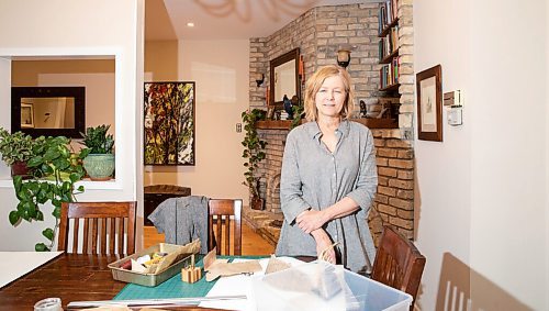 JESSICA LEE / WINNIPEG FREE PRESS

Deb Frances, a book artist, poses for a photo in her dining room with her materials on May 9, 2022.

Reporter: Brenda Suderman

