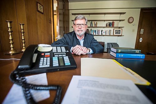 MIKAELA MACKENZIE / WINNIPEG FREE PRESS

Andrew Thomson, the Rectors Warden, poses for a portrait with the phone in the Rector's office at St. Georges Anglican Church (which is completely without MTS phone service right now) in Winnipeg on Tuesday, May 10, 2022. For Kevin story.
Winnipeg Free Press 2022.