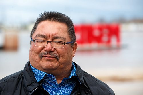 MIKE DEAL / WINNIPEG FREE PRESS
Peguis First Nation Chief Glenn Hudson during a quick interview between meetings Tuesday morning. 
Residents of Peguis FN who have not fled the rising water had a small reprieve Tuesday, which has allowed them to add protection to various locations and attempt to get basements emptied of water. The forecast doesn't look good towards the end of the week with days of rain on the way.
See Malak Abas story
220510 - Tuesday, May 10, 2022.