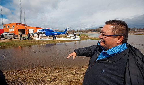 MIKE DEAL / WINNIPEG FREE PRESS
Peguis First Nation Chief Glenn Hudson checks out the status of the sandbag dike being built around the Peguis Emergency Centre and Firehall Tuesday morning. 
Residents of Peguis FN who have not fled the rising water had a small reprieve Tuesday, which has allowed them to add protection to various locations and attempt to get basements emptied of water. The forecast doesn't look good towards the end of the week with days of rain on the way.
See Malak Abas story
220510 - Tuesday, May 10, 2022.