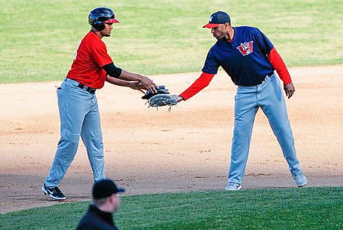 JOHN WOODS / WINNIPEG FREE PRESS
Winnipeg Goldeyes' David Washington (28) gathers the Fargo-Moorehead Redhawks batters gear after he made it to second in Winnipeg Monday, August 10, 2022.