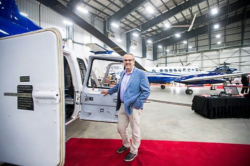 MIKAELA MACKENZIE / WINNIPEG FREE PRESS

Mike Pyle, CEO, poses for a portrait at the Exchange Income Corp. annual meeting in the Calm Air hangar in Winnipeg on Wednesday, May 11, 2022. For Martin Cash story.
Winnipeg Free Press 2022.