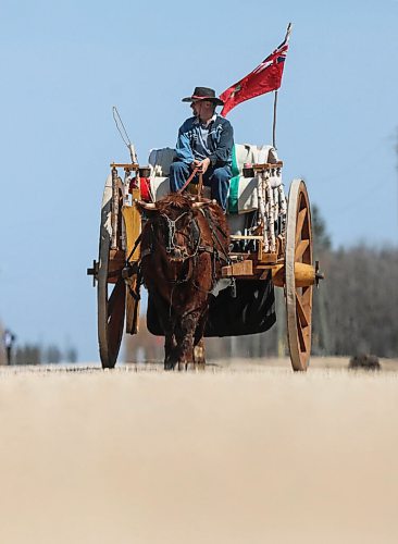 \RUTH BONNEVILLE / WINNIPEG FREE PRESS

Local. - Red River Ox Cart 

Feature photos of Terry Doerksen riding his authentic. Red River Ox cart with his ox along dirt roads in the Lockport area Friday as area children come by to check it out. 

 Doerksen is planning to ride his ox cart all the way to St. Paul Minneapolis along the original Red River passage. His wife follows him with their motorhome to accompany him.  

See story to info with Ben. 

Feature by Ben Waldman

May 06, 2022
