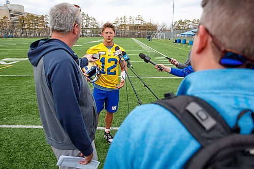 MIKE DEAL / WINNIPEG FREE PRESS
Winnipeg Blue Bombers quarterback Dakota Prukop (12) during a scrum with media after the first day of rookie camp at the practice field at the UofM Wednesday.
220511 - Wednesday, May 11, 2022.