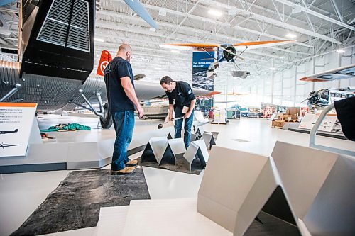 MIKAELA MACKENZIE / WINNIPEG FREE PRESS

David Doole (left) and Jay Ross with Kubik put together the guard rails at the new Royal Aviation Museum of Western Canada in Winnipeg on Wednesday, May 11, 2022. For Al Small story.
Winnipeg Free Press 2022.