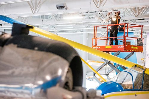 MIKAELA MACKENZIE / WINNIPEG FREE PRESS

Steve Puddister (with Eos Lightmedia) works on the lighting at the new Royal Aviation Museum of Western Canada in Winnipeg on Wednesday, May 11, 2022. For Al Small story.
Winnipeg Free Press 2022.